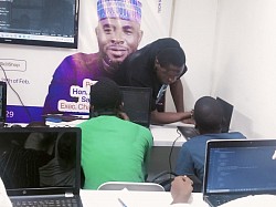 Mr. Fatai, giving a one on one explanation to one of the young attendees